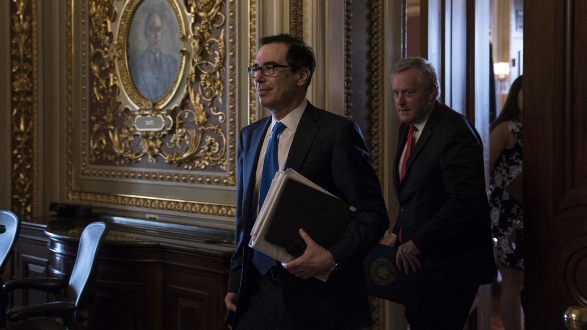 Treasury Secretary Steven Mnuchin, left, and Mark Meadows, White House chief of staff, walk through the U.S. Capitol on Tuesday.